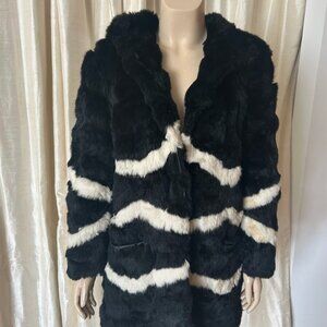 Black and white faux fur jacket by Blugirl. Features bold diagonal stripe patter
